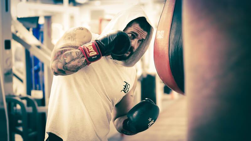 Athlete training with a punch bag