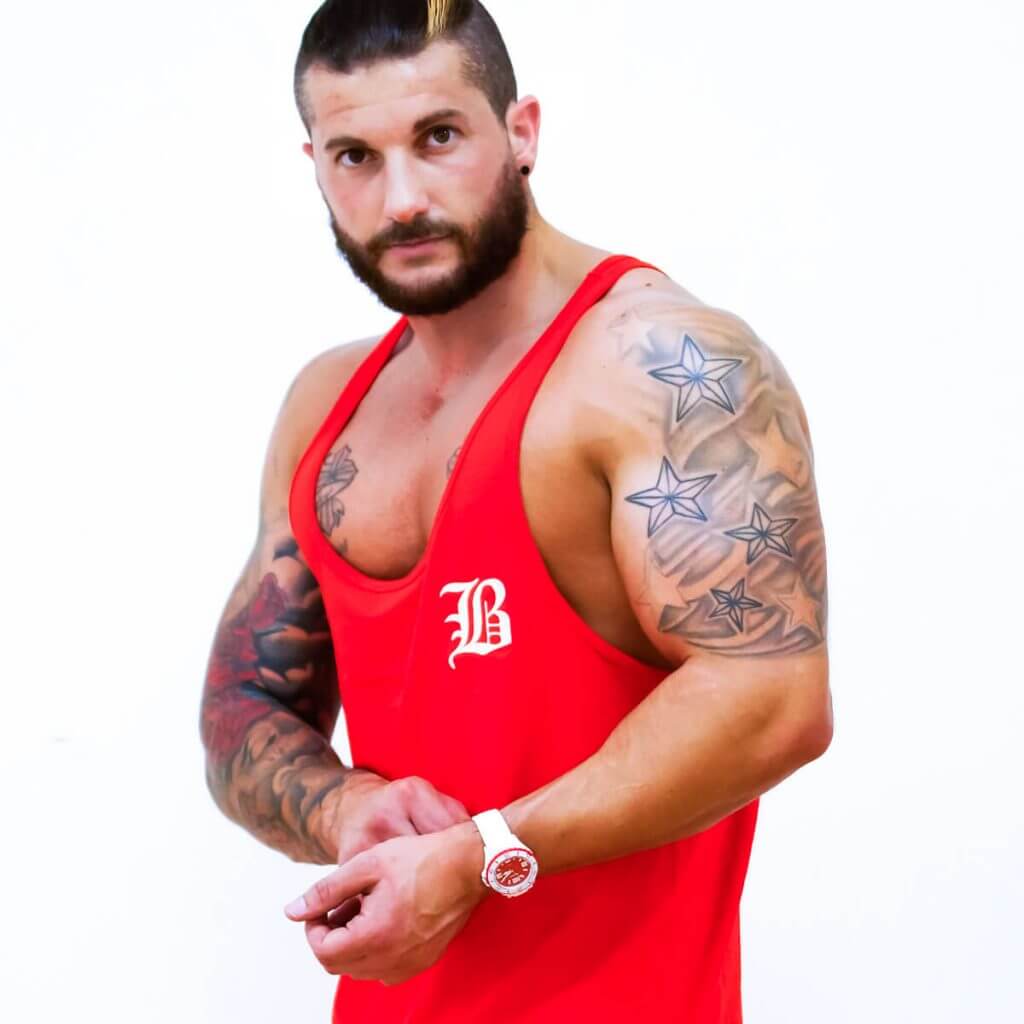 Red stringer vest for wearing at the gym, sporting events or just to show off those hard earned muscles
