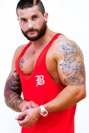 Red stringer vest for wearing at the gym, sporting events or just to show off those hard earned muscles